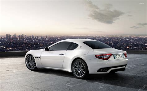 White Maserati GranTurismo In A Parking Lot Above The City Wallpaper Car Wallpapers