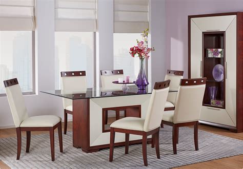 Wooden floorboards are topped with a cream rug, and a large. Sofia Vergara Savona Ivory 5 Pc Rectangle Dining Room with ...