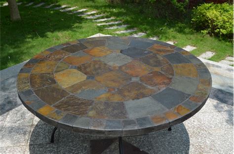 In its starting position, this table is a generous 61 in. 63'' Round Slate Outdoor Patio Dining Table Stone OCEANE