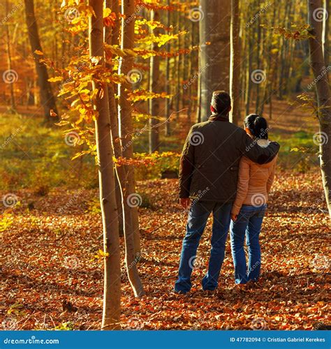 Young Couple In Forest While Autumn Stock Photo Image Of Happy Girl