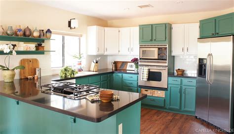 The history of postwar steel kitchen cabinets in fact starts decades before. two tone cabinets, green kitchen cabinets, stainless steel appliances, black quartz counters ...