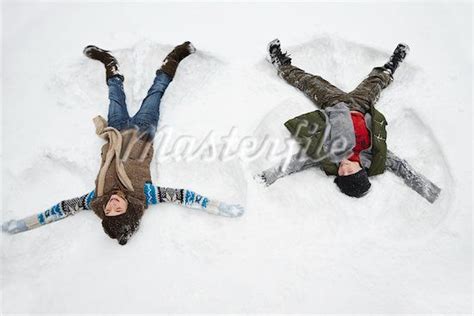Kids Making Snow Angels Stock Photos Masterfile Snow Angels