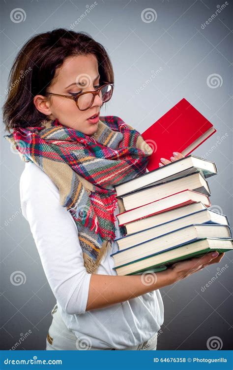 Female Librarian Holding A Pile Of Books Stock Photo Image 64676358