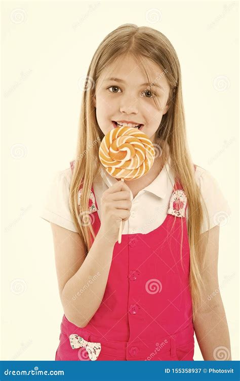 Girl Eat Lollipop On White Little Child Enjoy Candy On Stick Happy