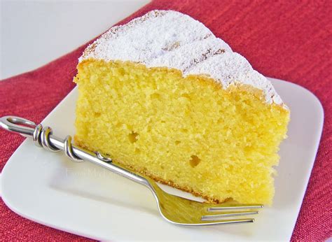 In a large mixing bowl with an electric mixer on low, combine the cake mix, 4 ounces of softened butter, the sour cream, milk, eggs, 2 tablespoons of lemon juice, 2 to 3 teaspoons of lemon zest, and 1 teaspoon of lemon extract. Lemon and sour cream cake - Lisa's Lemony Kitchen