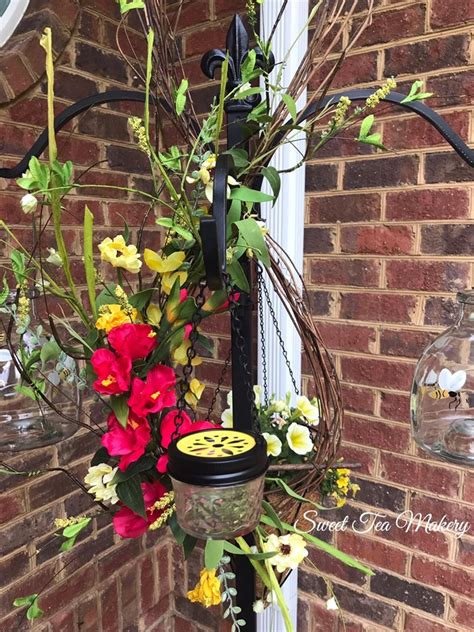 It's an easy project and the feeders are very easy to clean. DIY How To Make A Hummingbird Wreath and Mason Jar Feeder - Sweet Tea Makery
