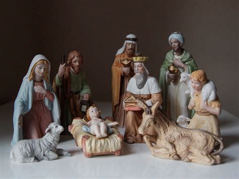 A Group Of Figurines Sitting On Top Of A Table