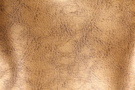 Sklyra Vinyl Upholstery Fabric In Gold