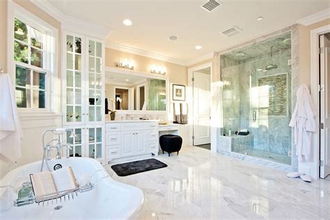 The modesty of the pure white walls and standard sized off white tiles compliment the modern elements of the wall mounted inverted pyramid shaped toilet basin. 25 Most Popular Master Bathroom Designs For 2016