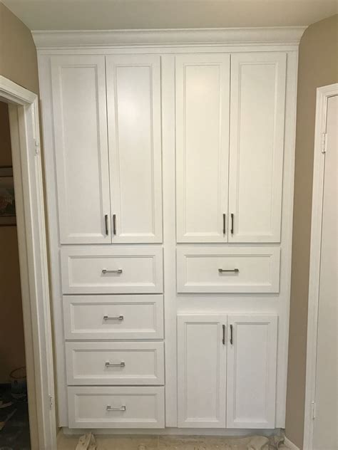 Custom Built White Raised Panel Linen Built In Custom Cabinetry