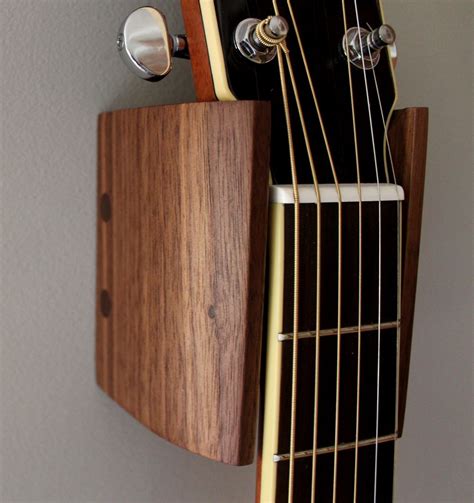 Guitar holder wall mounted guitar bracket wooden hanging rack space saving guitar hanger with pick holder and 3 hook for display. Guitar Hangers with Solid Black Walnut - Free Design Plans ...