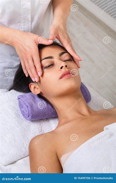 Beautician Doctor Doing Rf Lifting Procedure For Flawless Woman Face Laying In A Beauty Salon