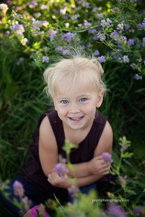 Cute Blue Eyed Blonde Haired Child In Purple Flowers Photography