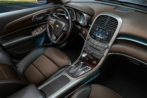 Interior view of a 2013 chevy malibu ltz with ambient lighting and chevrolet mylink. 2013 Chevrolet Malibu Interior Photos | CarBuzz