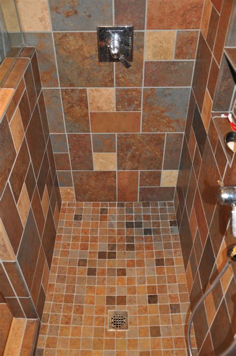A seamless floor tile transition into the shower. Tile is not just something to cover your shower walls ...