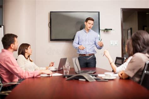 Young Boss Leading A Meeting Stock Photo Image Of Speaker Attractive