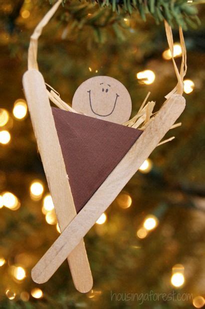 An Ornament Made To Look Like A Triangle With A Smiling Face On It