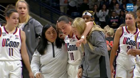 paige bueckers azzi fudd watch in shock as nika muhl takes knee to head left game uconn