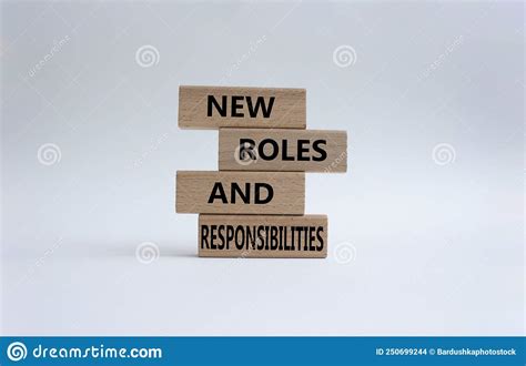 New Roles And Responsibilities Symbol Wooden Blocks With Words New