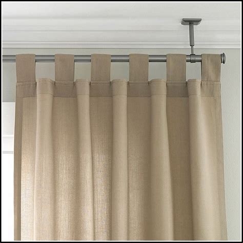 While the wall above the window opening is the traditional location for a traverse curtain rod, there is no reason why you cannot install it in the ceiling above the window. Shower Curtain Rods That Hang From Ceiling - Curtains ...