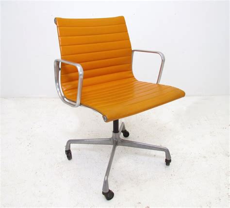 Orange naugahyde upholstery on aluminum frame and base. Vintage Aluminum Group Eames Management Chair for Herman ...