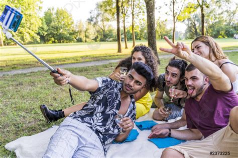 Multiethnic Group Of Millennial Friends Take A Selfie While Celebrating