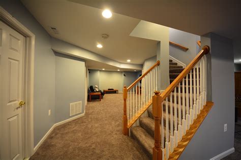 A staircase railing of clear glass panels, outlined and mounted in a simple metal frame, is minimalist chic.but it also keeps a small space, one that could feel dark and crowded, light and airy. Stair Railings and Half-Walls Ideas | BasementRemodeling.com