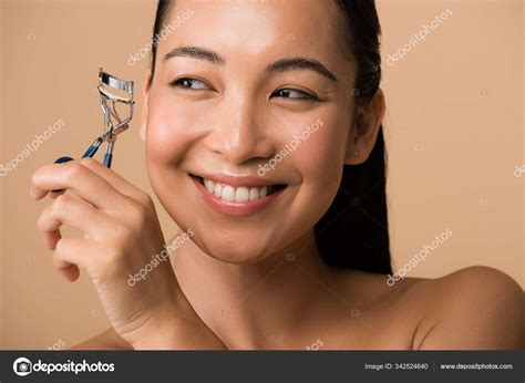 Smiling Beautiful Naked Asian Girl Holding Eyelash Curlers Isolated Beige Stock Photo By