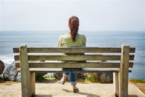 Woman Sitting On Bench Back View