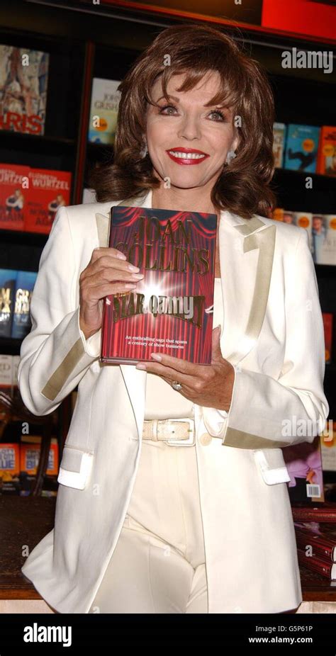 Actress Joan Collins Poses With Copies Of Her Her Latest Novel Star Quality During A Signing