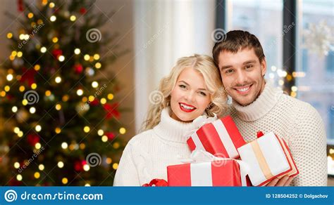 Happy Couple With Christmas Ts At Home Stock Photo Image Of