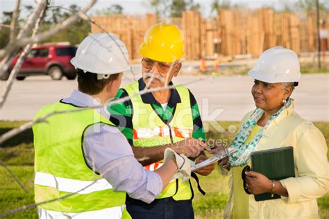 Construction Workers Supervisor Engineer Talk At Job Site Stock
