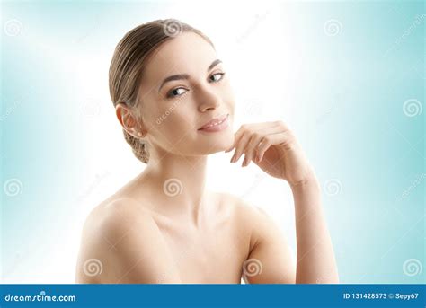 Young Woman With Glowing Skin Posing At Isolated Light Blue Background Stock Image Image Of