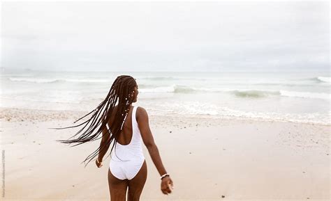 Black Woman In Swimsuit In Nature By Stocksy Contributor Marco Govel