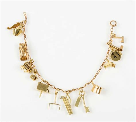 10k Yellow Gold Charm Bracelet With Fourteen Charms