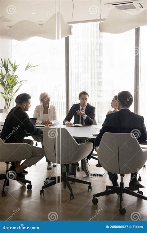 Young Boss Ceo Executive Speaking To Managers On Team Meeting Stock