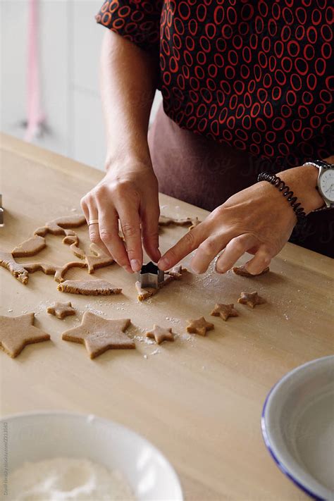 Crop Lady Cutting Gingerbread Stars Del Colaborador De Stocksy Danil Nevsky Stocksy