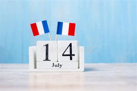 Wooden Calendar Of July 14th With Miniature France Flags French