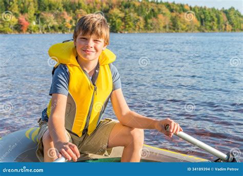 Boy In A Boat In Water Stock Photo Image Of Plastic 34189394