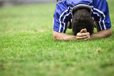 Soccer Player With Head Down On Grass Sports Psychology Today Sports Psychology