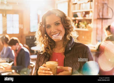 Portrait Smiling Woman Drinking Iced Coffee In Cafe Stock Photo Alamy