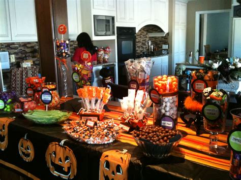 A Table Filled With Candy And Candies For Halloween