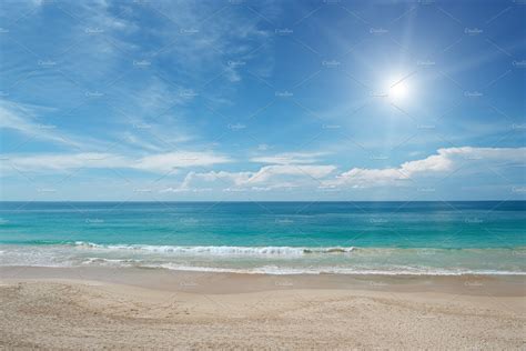 Sandy Beach And Sun In Blue Sky Background Stock Photos ~ Creative Market