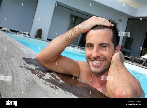 Portrait Of Smiling Guy In Swimming Pool Stock Photo Alamy