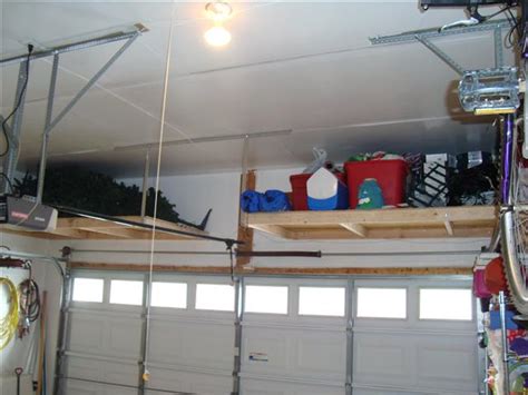 I am constantly cleaning, organizing and dreaming about ways to this process of installing a storage kit was a lot simpler than building from scratch, but with our crazy high ceilings the installation still took a long time. Inspiring Garage Overhead Storage Diy #4 Diy Overhead ...