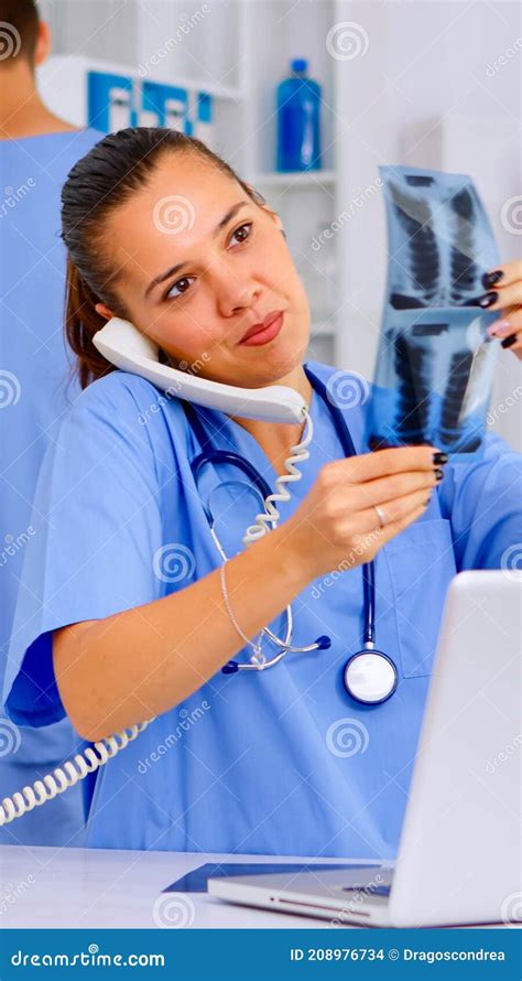Physician Nurse Answering Patient Call By Phone Stock Photo Image Of