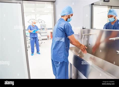 Doctor Or Nurse Washing Hands For Disinfection And Hygiene Before The