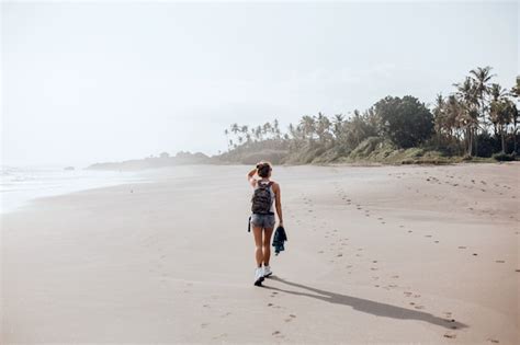 Free Photo Young Beautiful Girl Posing On The Beach Ocean Waves Bright Sun And Tanned Skin