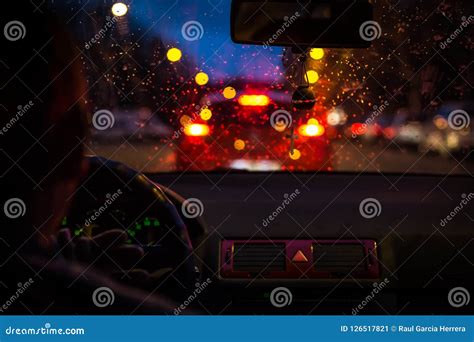 Bokeh Lights From Traffic Jam Through A Car Windscreen On Rainy Night