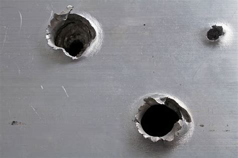 Bullet Hole Pictures Images And Stock Photos Istock